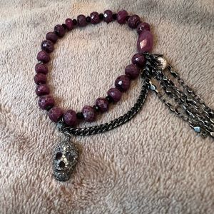 Love-Thirteen bracelet. Skull charm and garnet stones.
